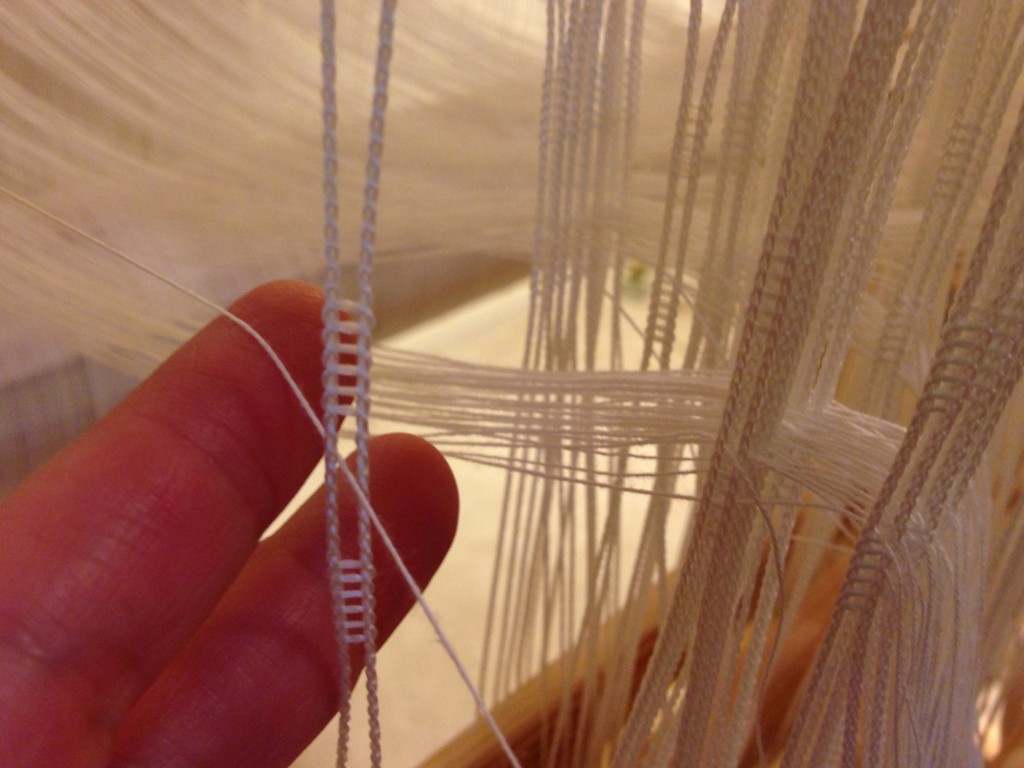 Texsolv heddles being threaded