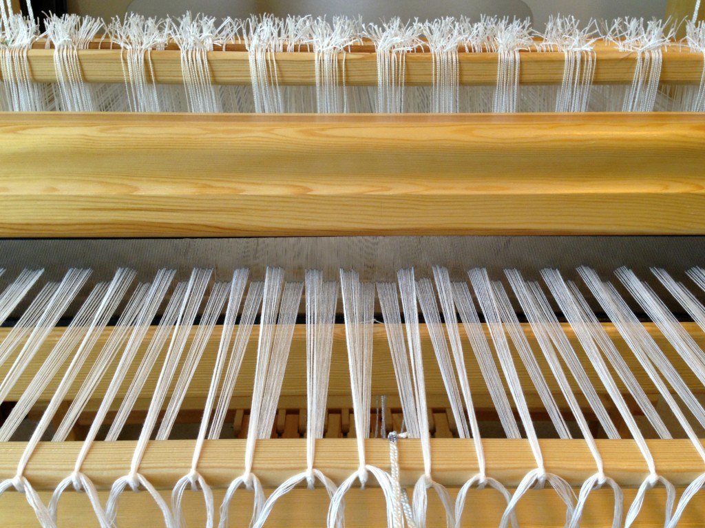 Warp tied to front tie-on bar