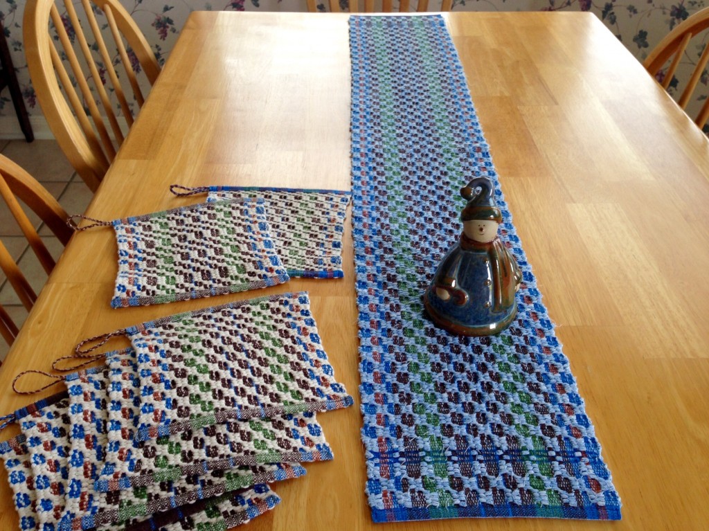 Rag weave table runner and string yarn pot holders in M's and O's. Karen Isenhower