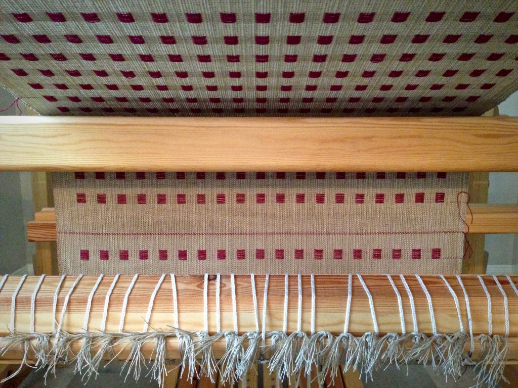 Linen dice weave coming around the cloth beam. Karen Isenhower