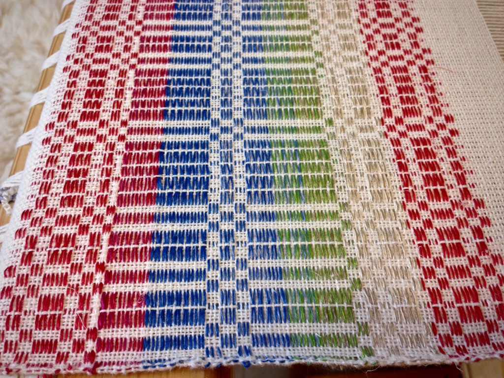 Sampling various linen color options for halvdräll table squares.