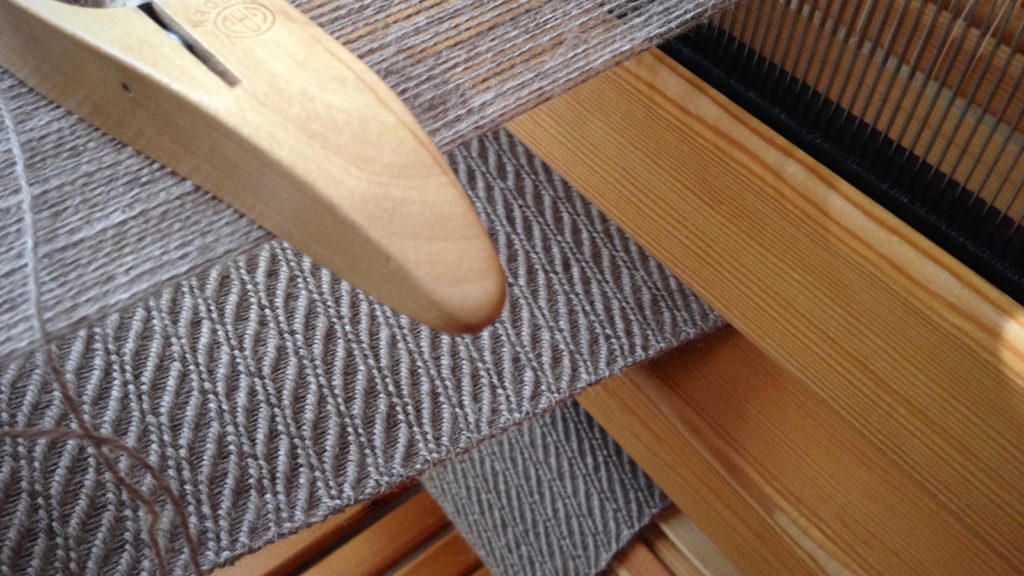 Long alpaca scarf on the loom. Slow and gentle weaving.