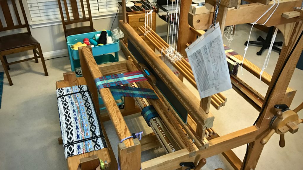 Weaving draft in place for weaving mug rugs.