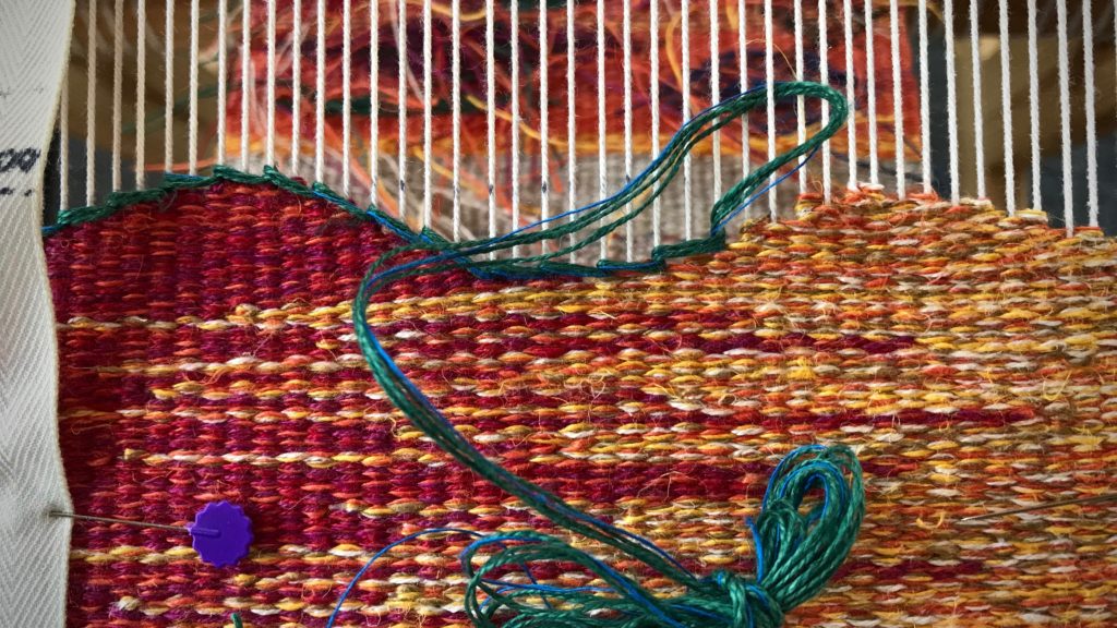 Soumak border on tapestry sampler.