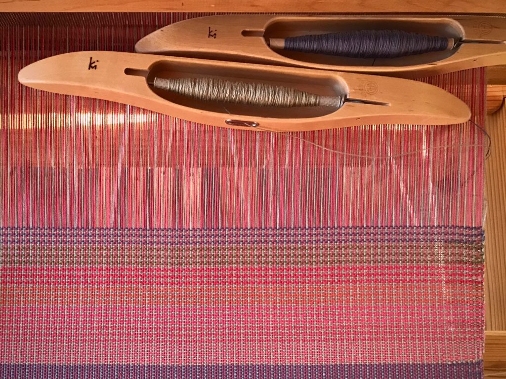 Color-and-weave effects with plain weave and 2 shuttles.