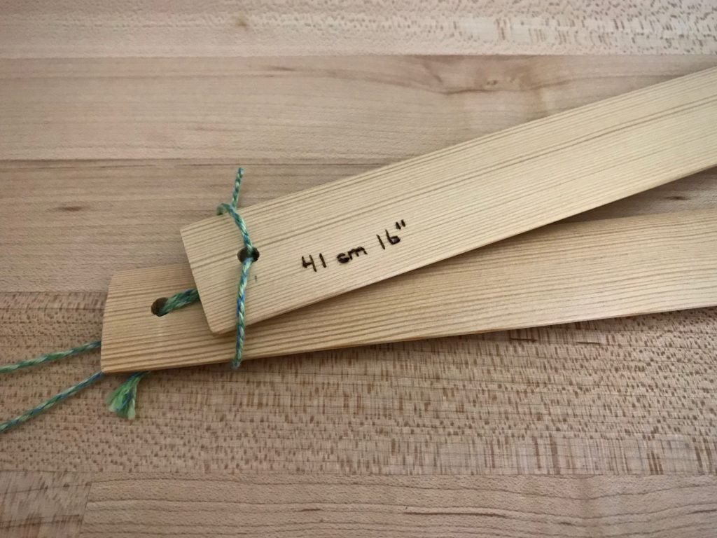 Weaving tip: Measured lease sticks paired together for hanging.