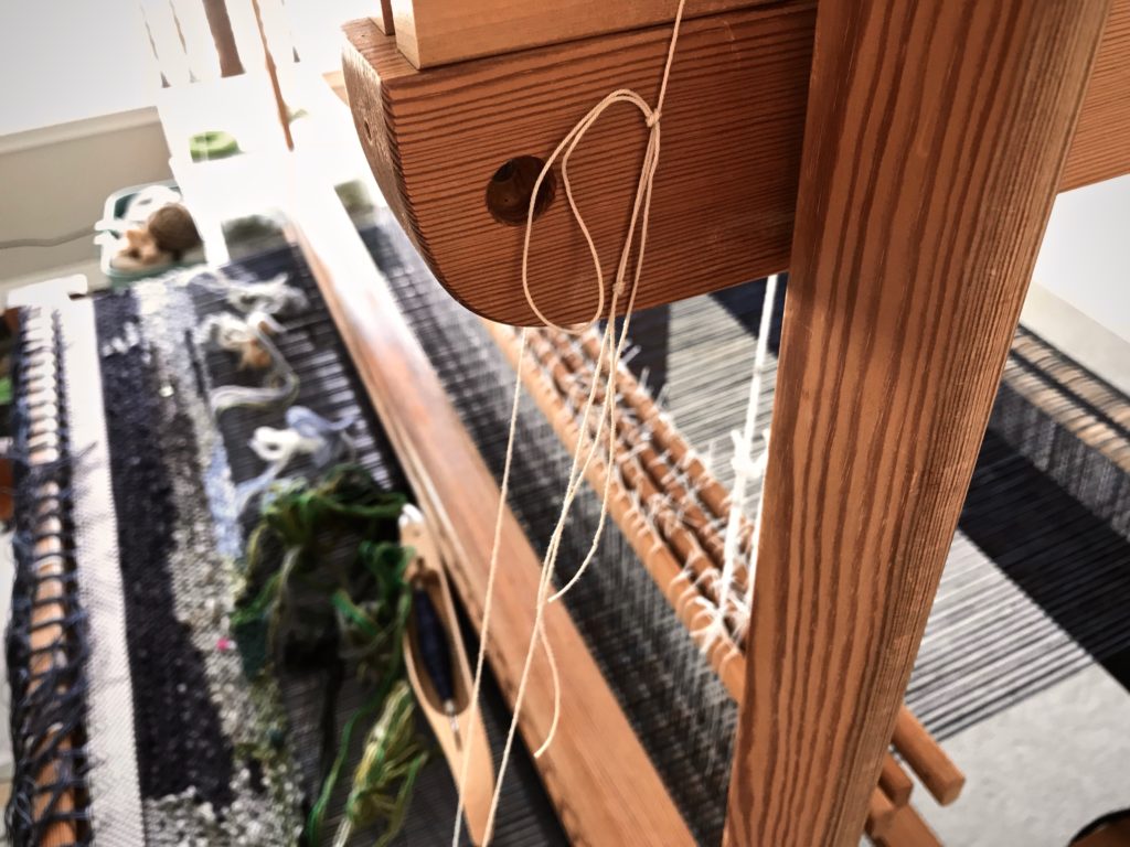 Weaver's tie-up knot helps hold the tapestry cartoon.